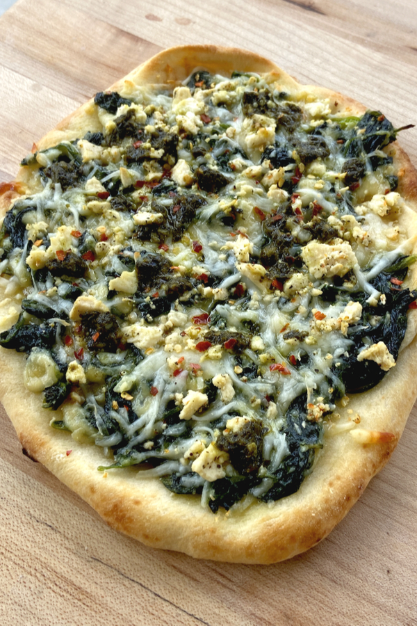 naan flatbread with spinach cheese and pesto