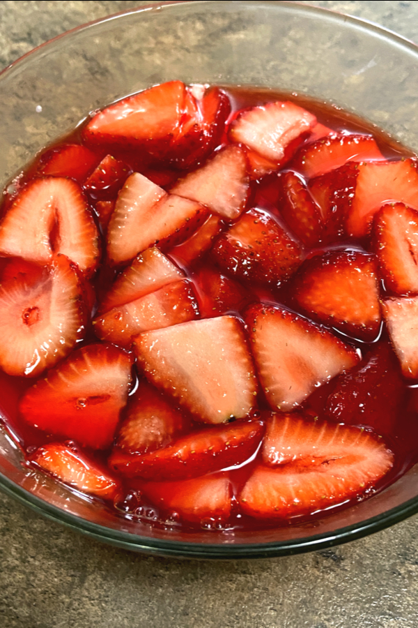 sliced strawberries in strawberry gelatin 