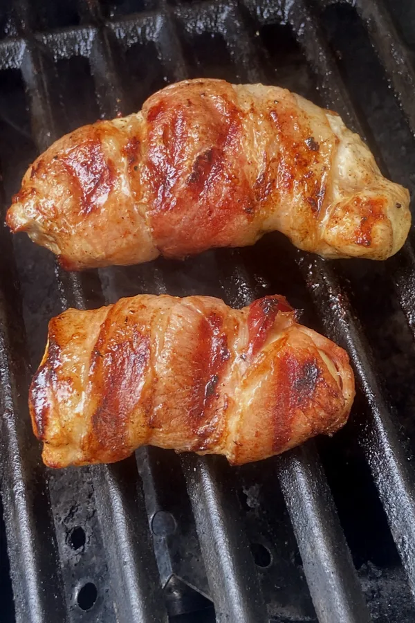 bacon wrapped chicken on grill