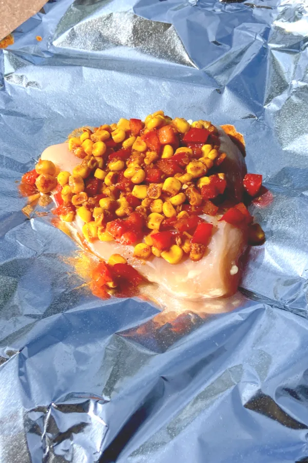 chicken on foil packet with salsa on top