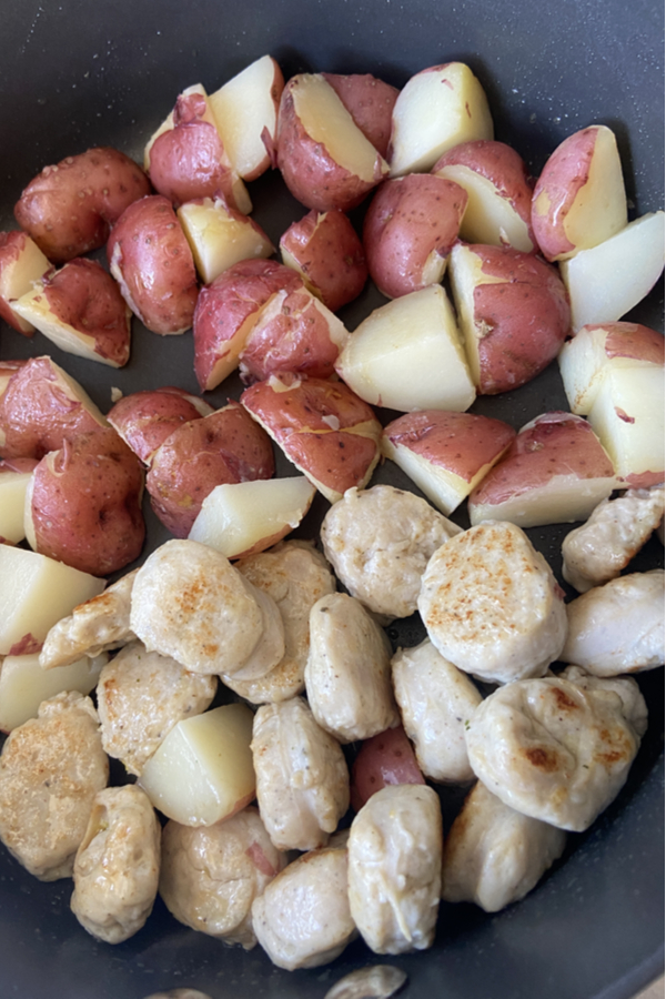 browning sausage & potatoes in skillet 