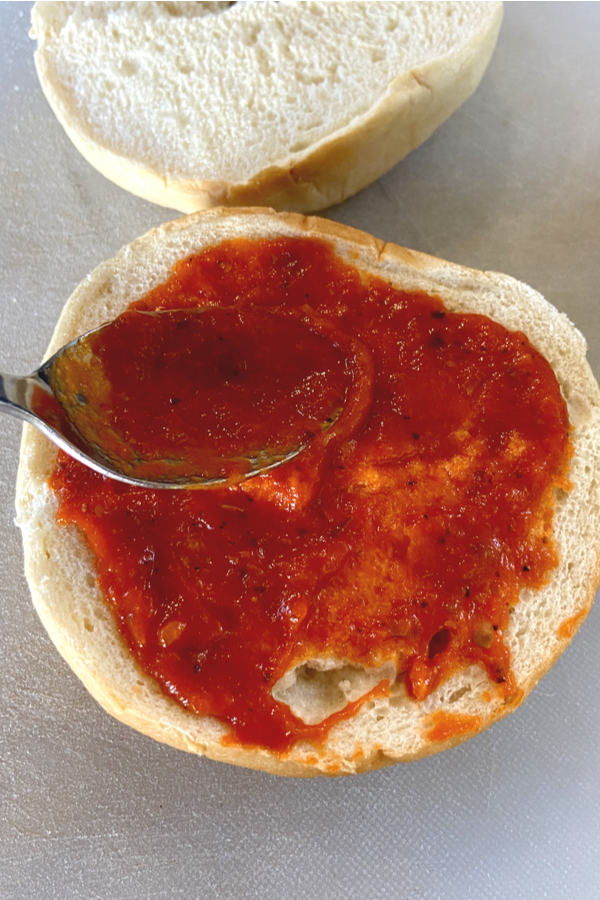 pizza sauce on a bagel