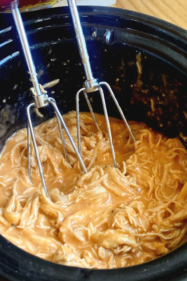 shredding chicken with a hand mixer 