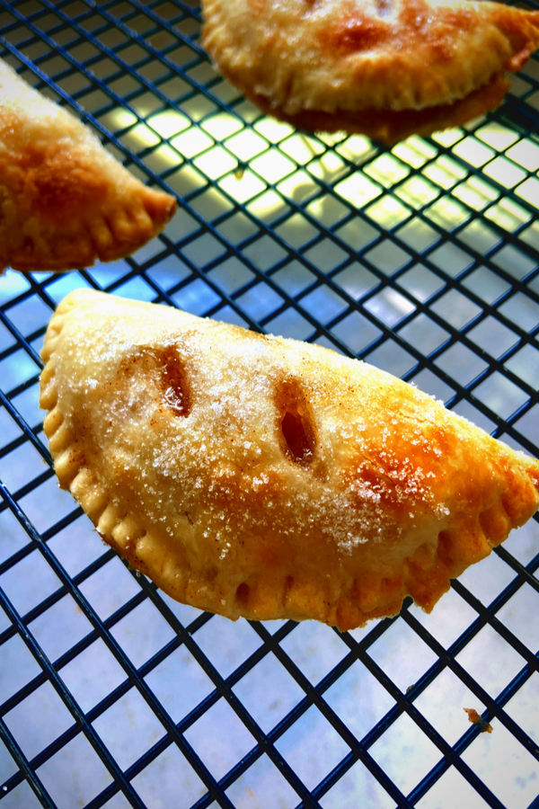 baked apple hand pies on cooling rack 