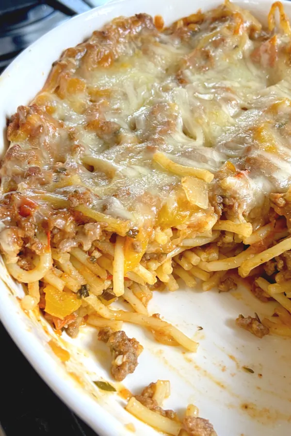 baked spaghetti with scoop taken out
