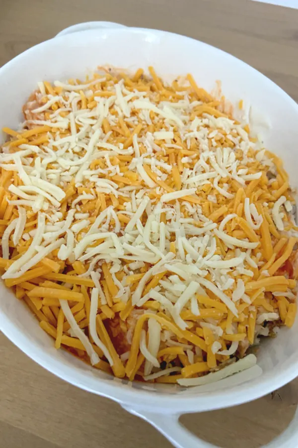shredded cheese on top of dip 