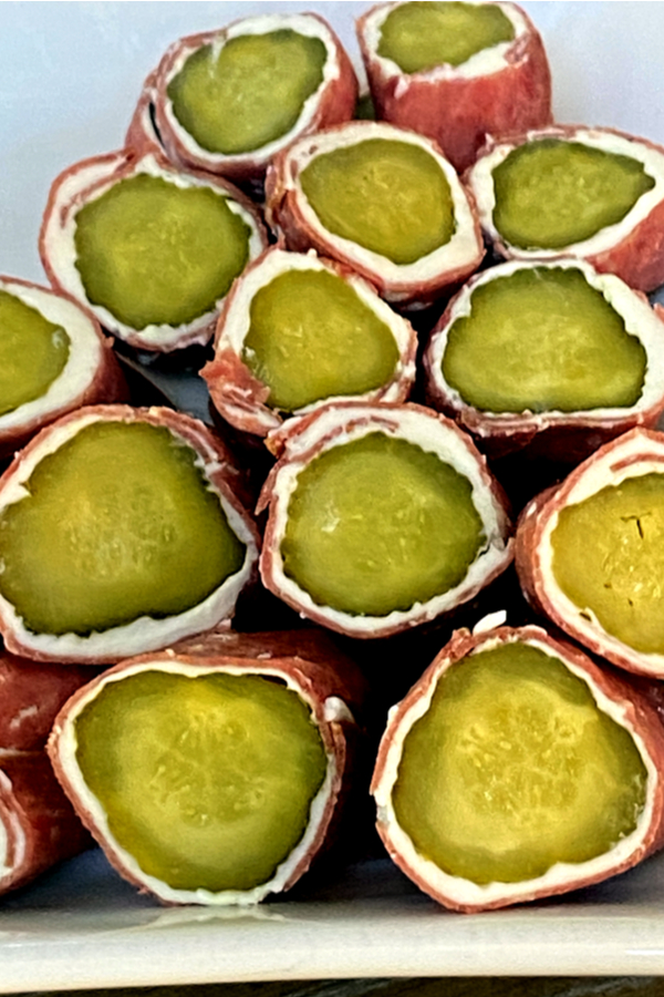sliced pickles wrapped in cream cheese and beef 