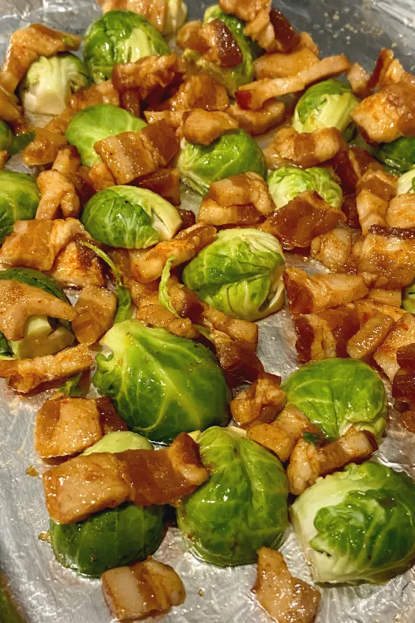 bacon and Brussels sprouts on foil lined baking sheet 