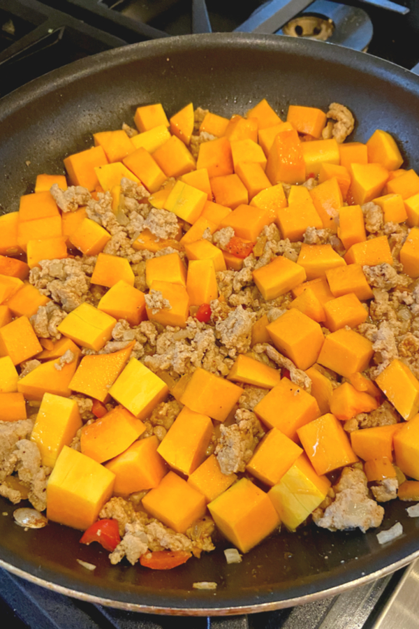 butternut squash and ground turkey being cooked 