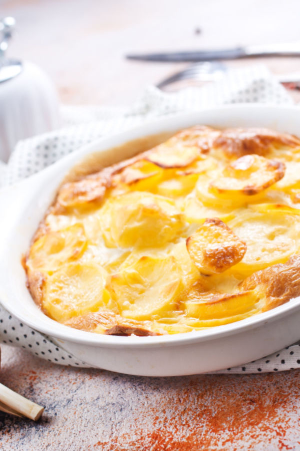 peppered scalloped potatoes in a oval dish