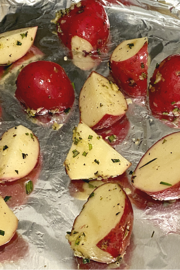 rosemary potatoes on a foil lined baking sheet 