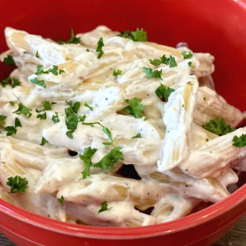 cream cheese pasta in red bowl