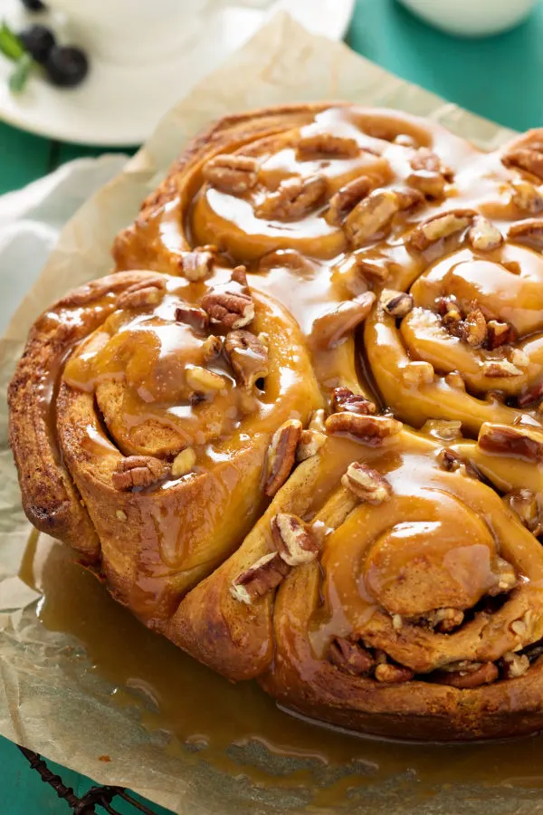 Sticky buns that have been flipped over on a plate