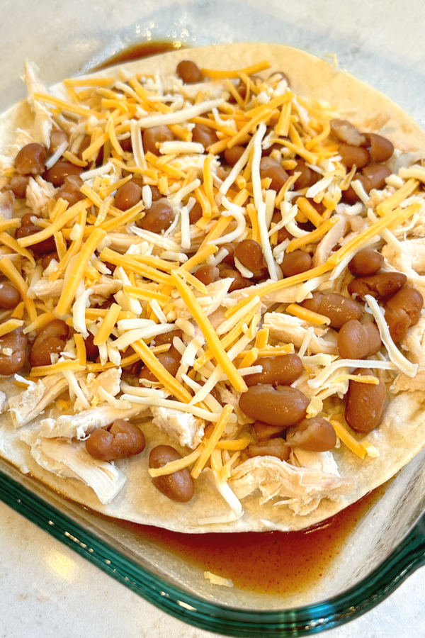 chicken beans and cheese on tortilla shell