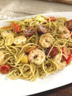 shrimp pesto pasta on white plate