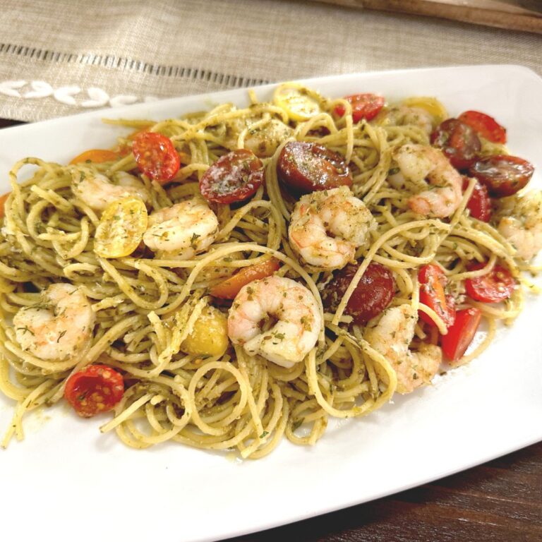 shrimp pesto pasta on white plate