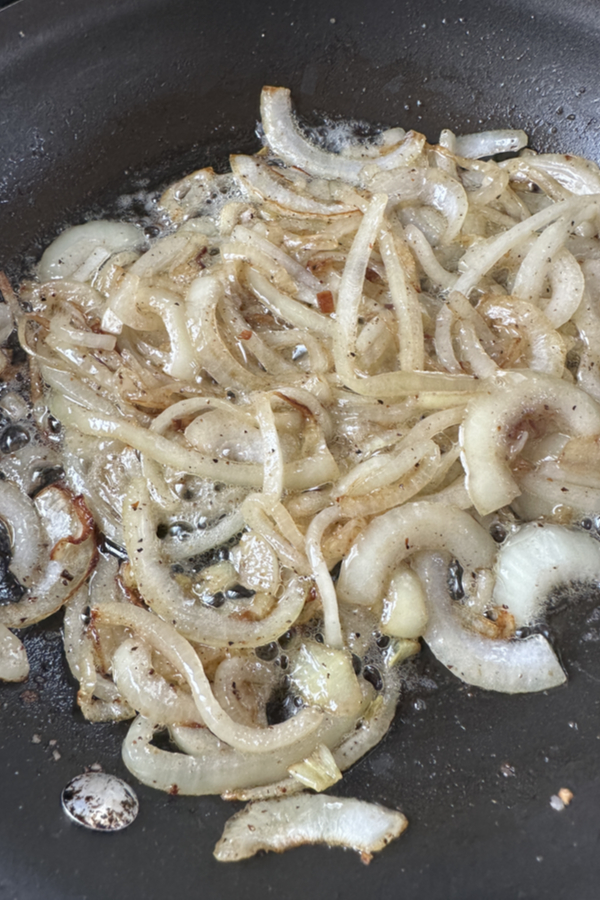 onions sautéing in skillet