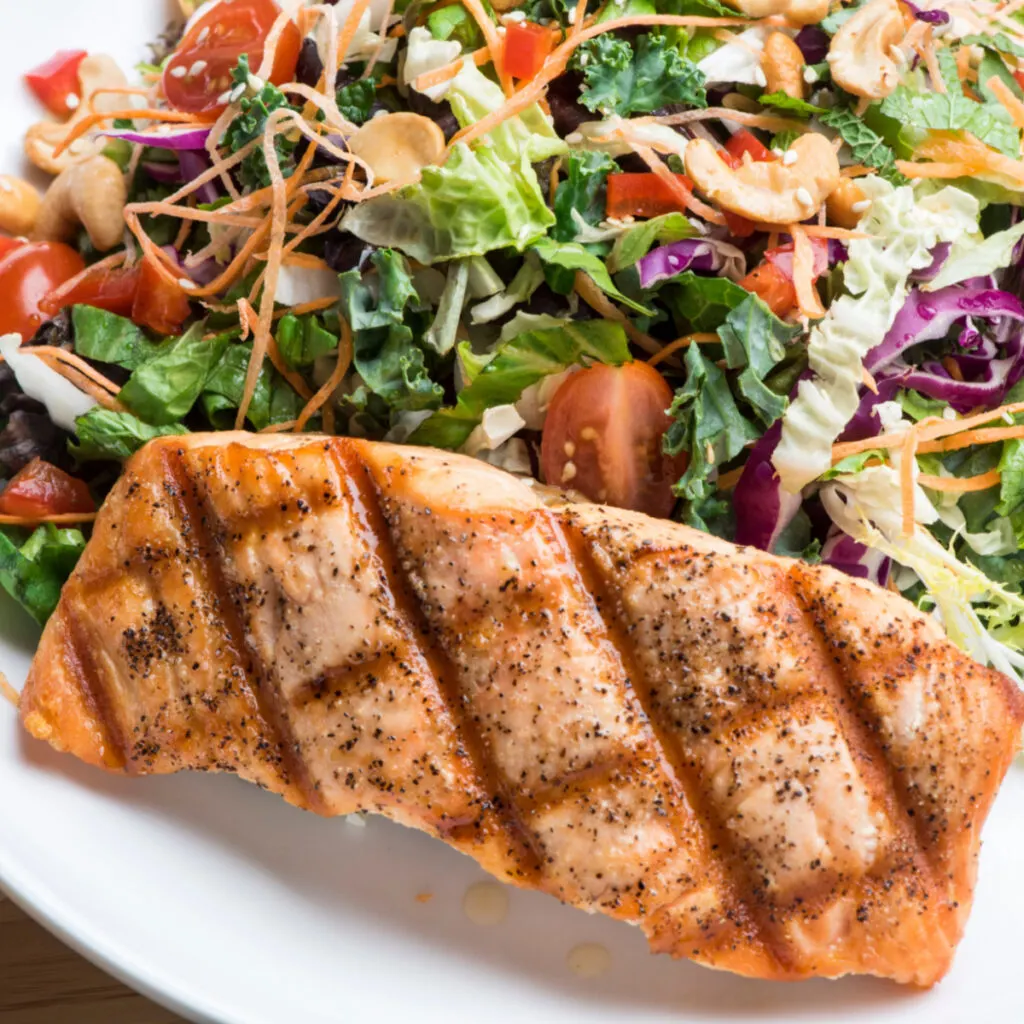 grilled salmon served with salad
