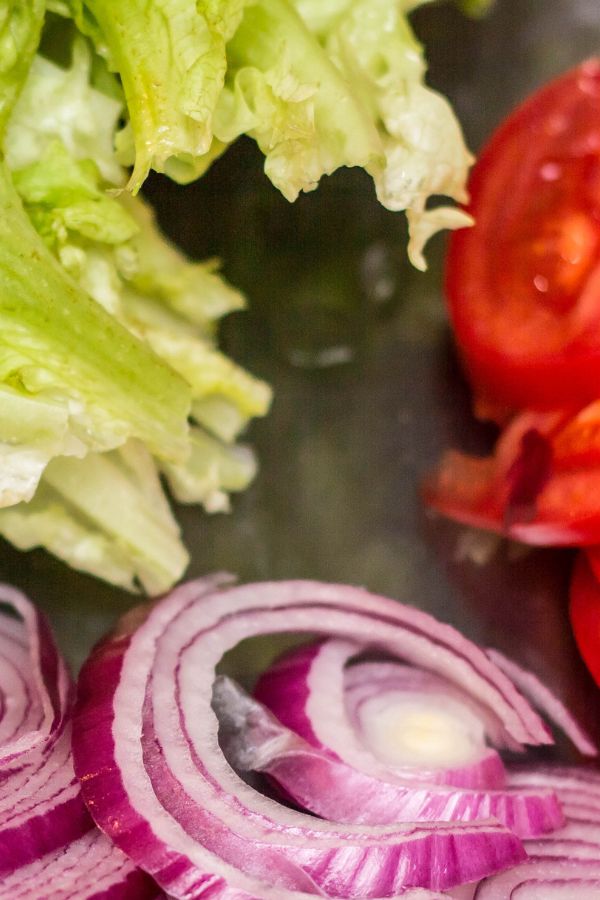 fresh vegetables: lettuce, tomato, red onion