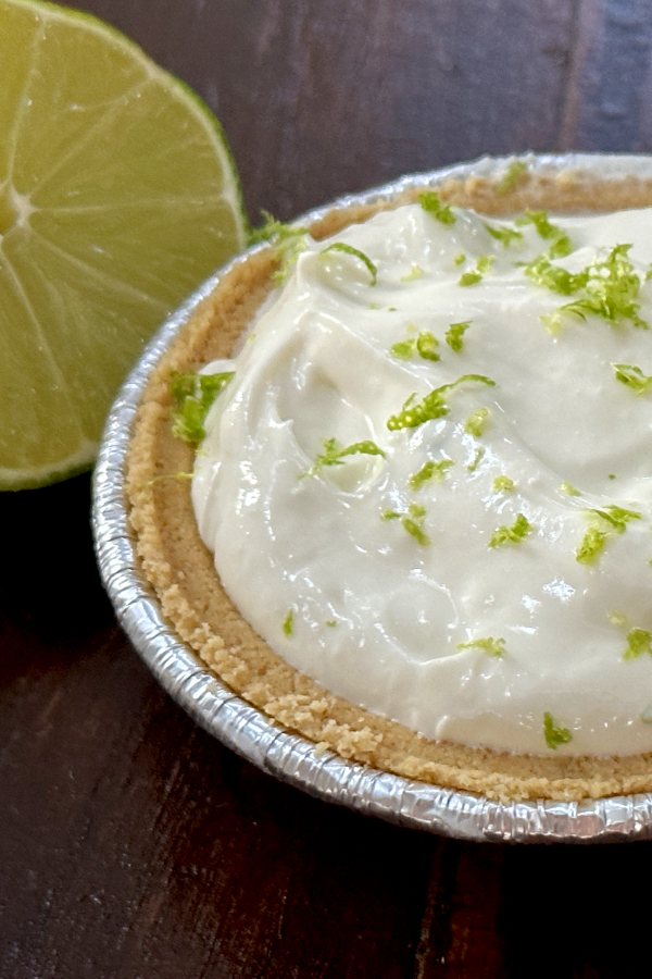 no bake key lime cheesecake with a half of lime