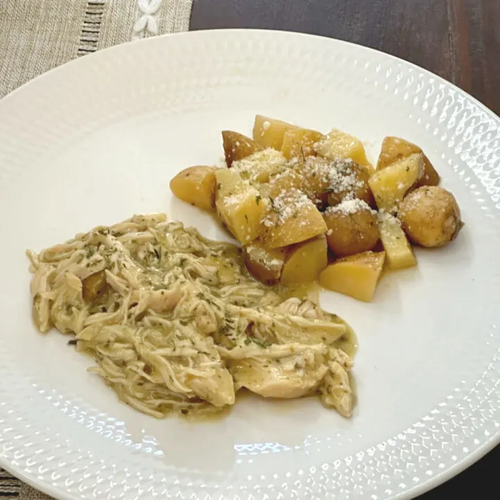 crock pot ranch chicken and potatoes on white plate