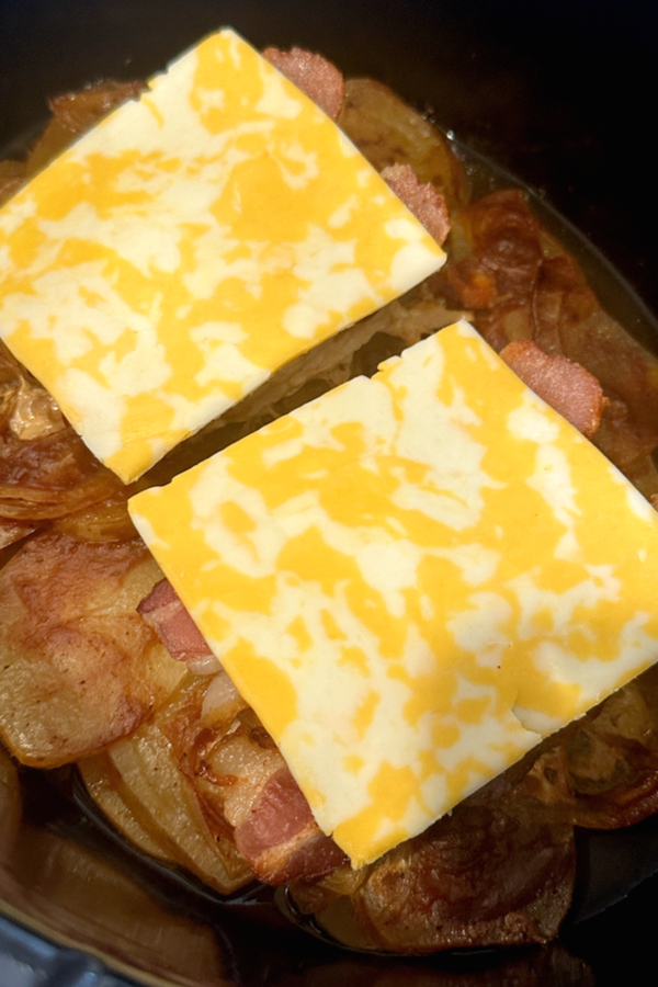 colby jack cheese on raw barbecue pork chops