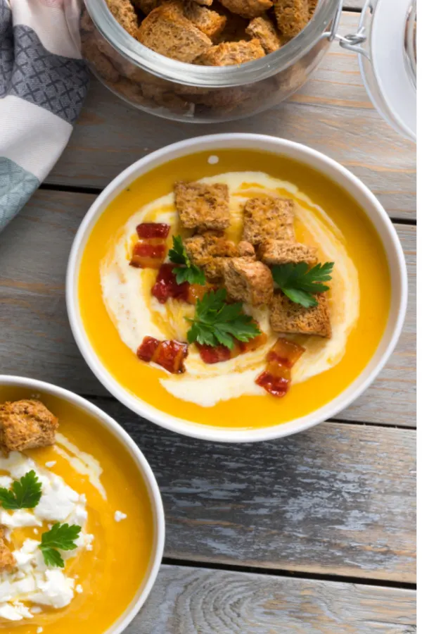 butternut squash soup with croutons and bacon toppings