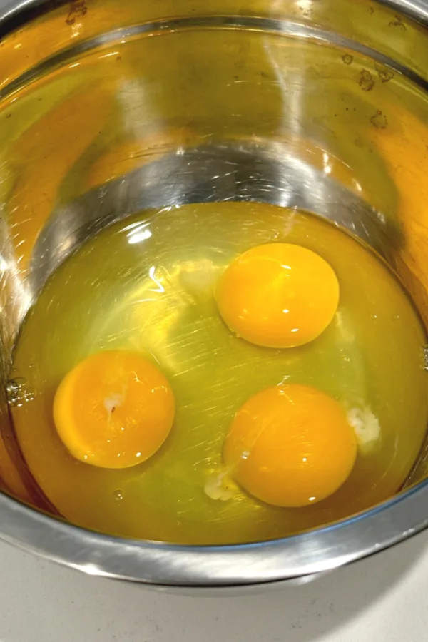 3 raw eggs in bowl