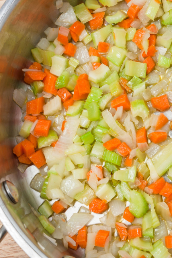onion celery carrots in pot