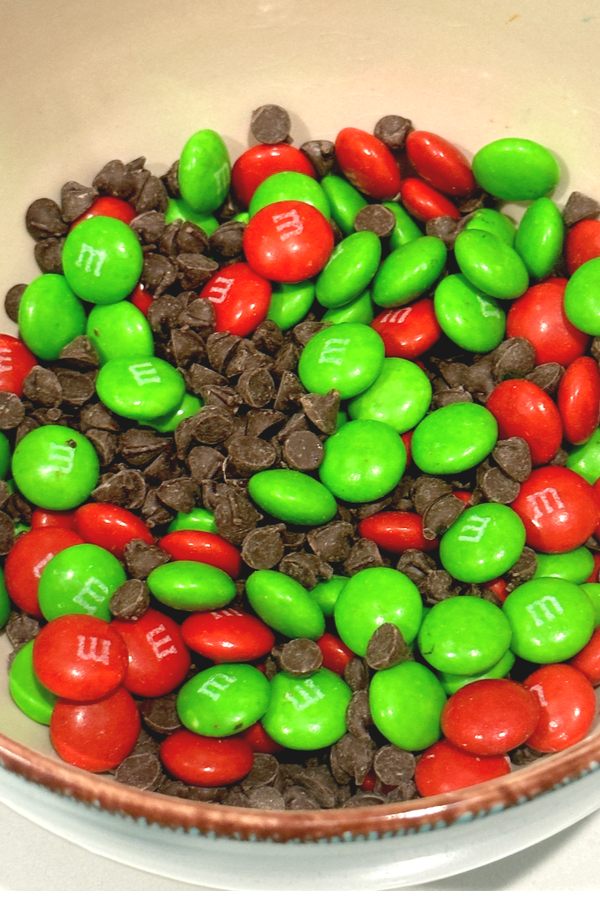 Red and green M&Ms mixed with miniature chocolate chips.