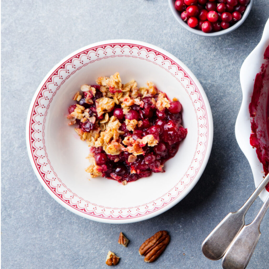 A bowl of cranberry apple crumble