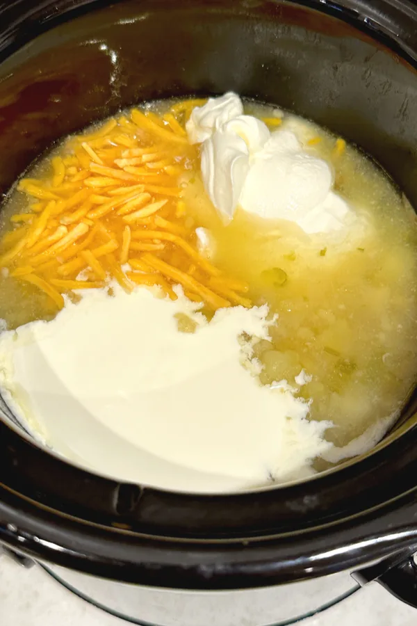 milk, cheese and sour cream in crock pot