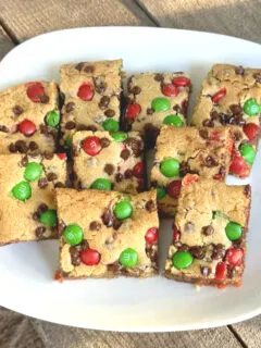 M&M Cookie bars on a plate and ready to be eaten.