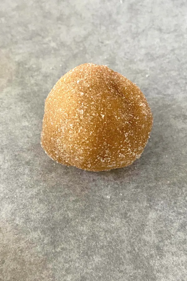 peanut butter cookie dough ball rolled in sugar