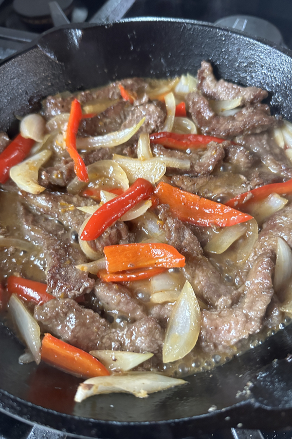 crispy orange beef stir fry with peppers and onions