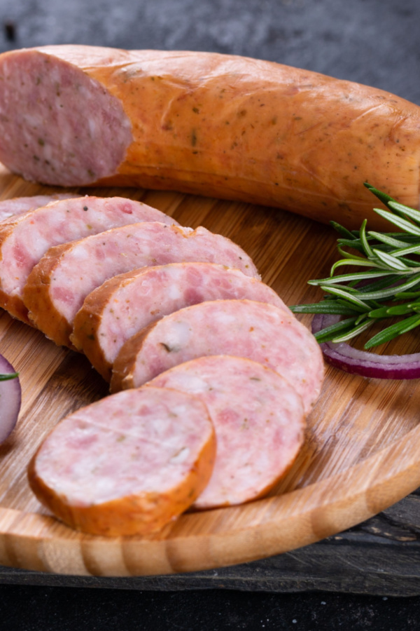 cutting andouille sausage