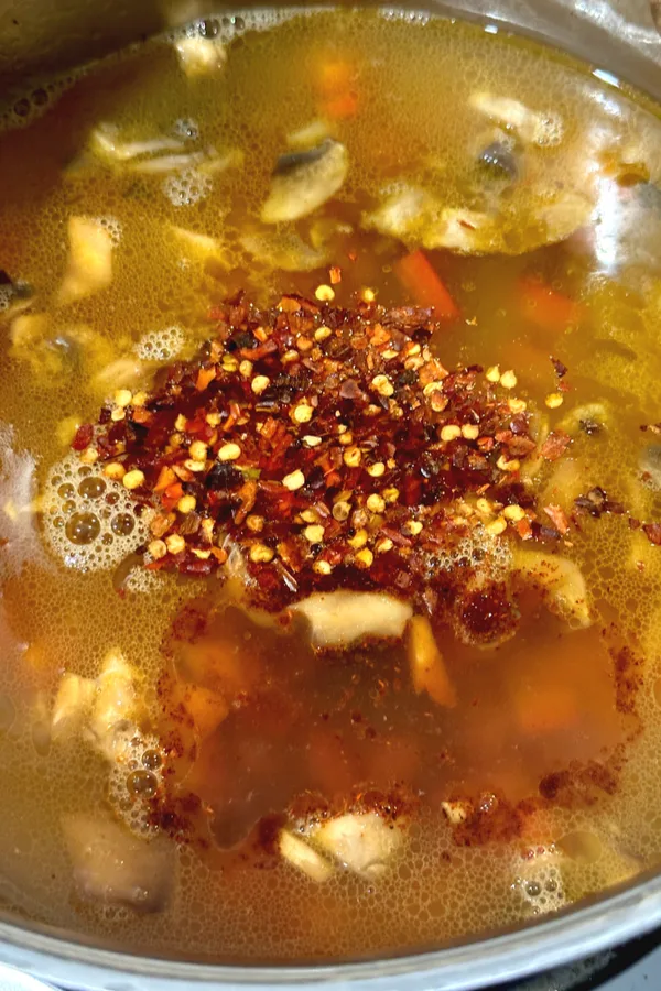 red pepper flakes in spicy chicken soup