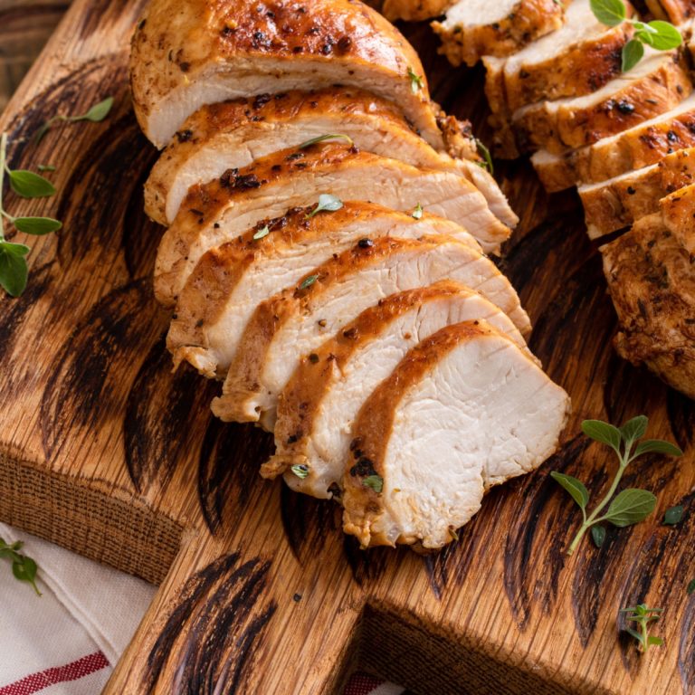 air fryer thin chicken breast sliced on cutting board