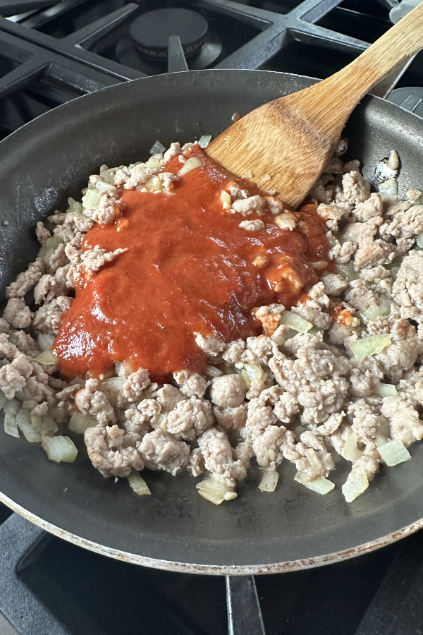 ground meat with marinara sauce in skillet