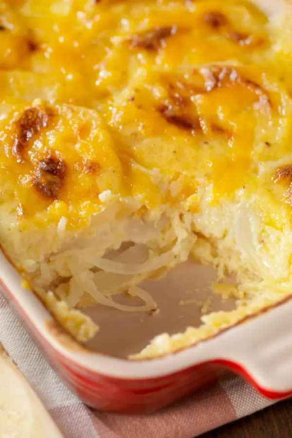 au gratin potatoes scooped from baking dish