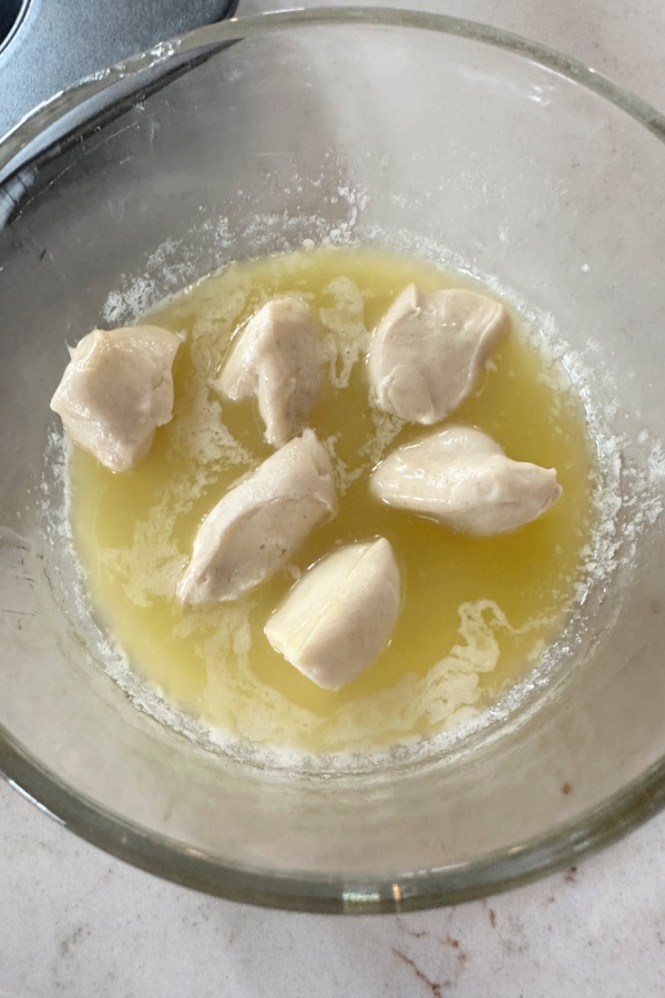 cut dough in melted butter