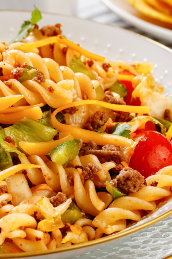 pasta, vegetables and ground beef in a bowl