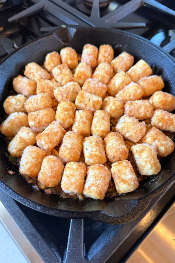 tater tots on sloppy joe casserole as one skillet recipe