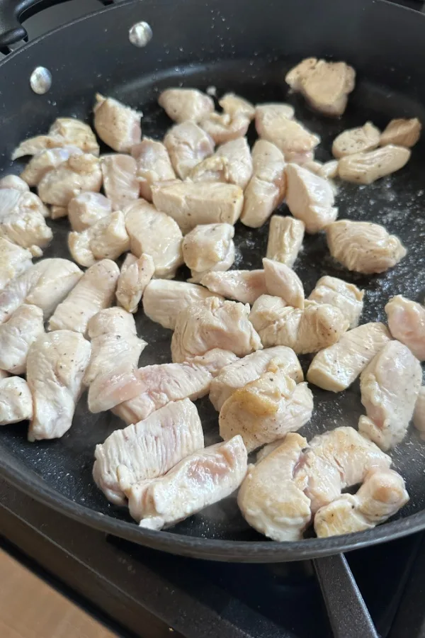 diced chicken breast in skillet 