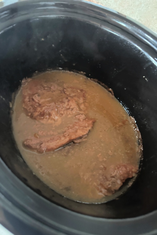 crock pot with beef and gravy