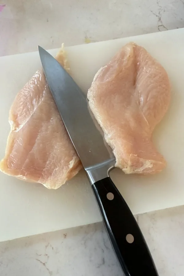 cutting chicken breast into two