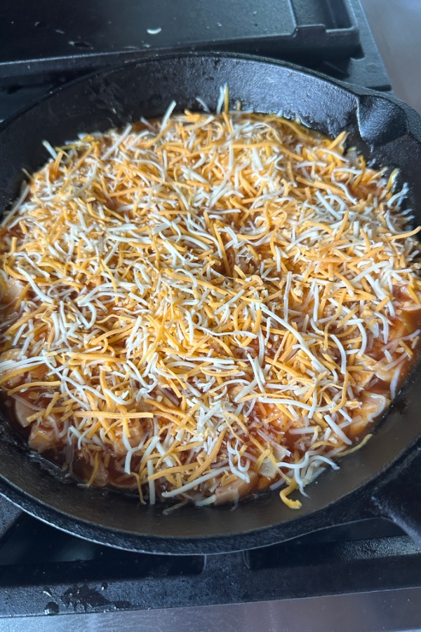 shredded cheese in skillet