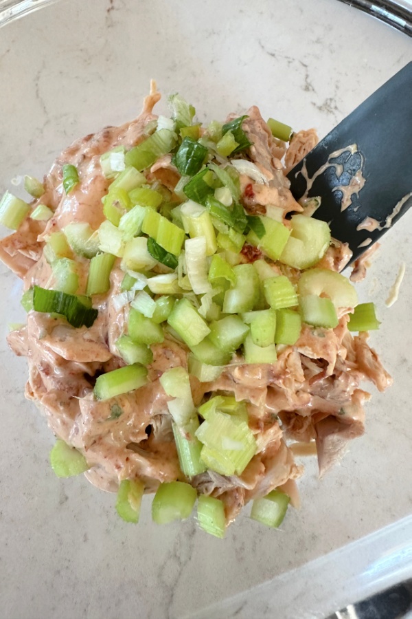 diced celery and onion with shredded chicken