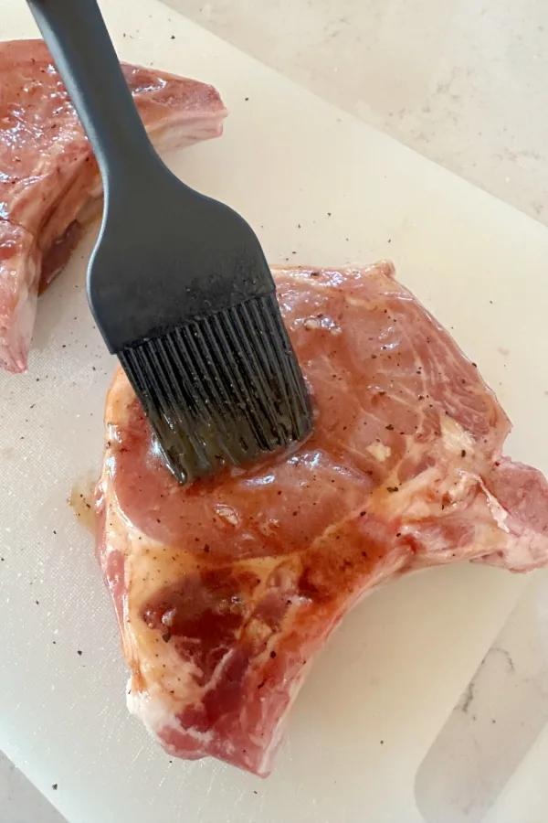 brushing glaze on meat