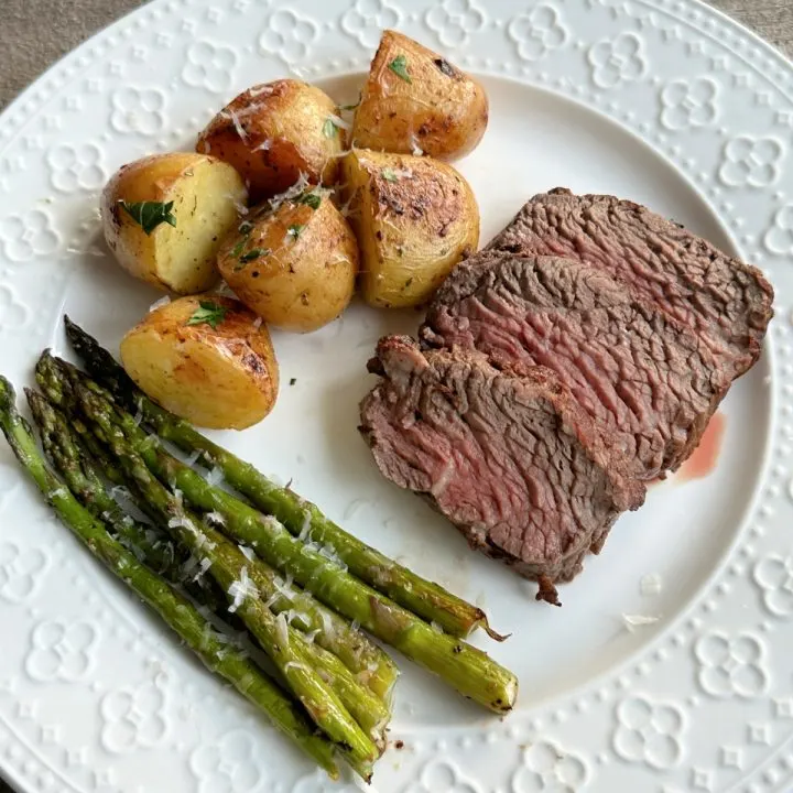 petite filet of beef and potatoes and asparagus